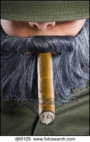 Closeup of man with fake beard and cigar View Large Photo Image Stock Photo - Closeup of man with fake beard and cigar. Fotosearch