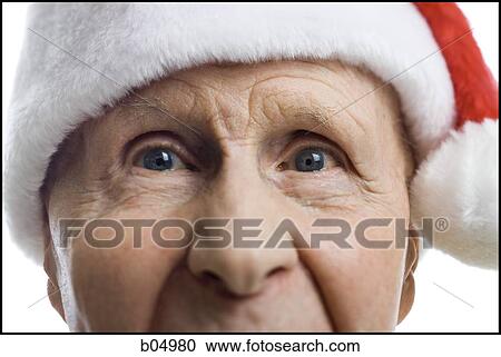 Closeup of mature man in santa hat View Large Photo Image Stock Image - Closeup of mature man in santa hat. Fotosearch