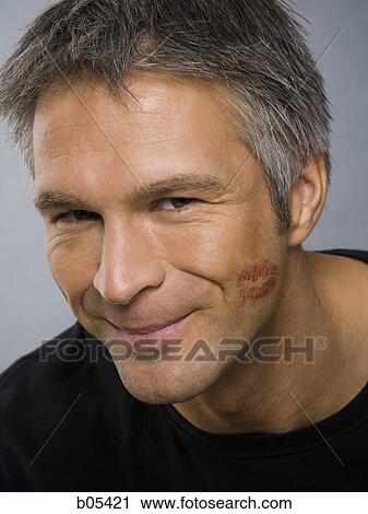 Closeup of mature man with lipstick kiss on cheek View Large Photo Image Stock Image - Closeup of mature man with lipstick kiss on cheek. Fotosearch