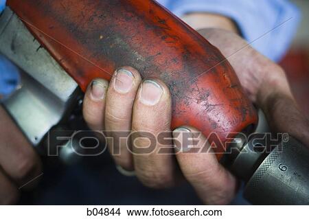 Closeup of mechanic hand with drill View Large Photo Image Picture - Closeup of mechanic hand with drill. Fotosearch