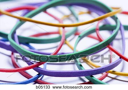 Stock Image - Closeup of multicoloured rubber bands. Fotosearch