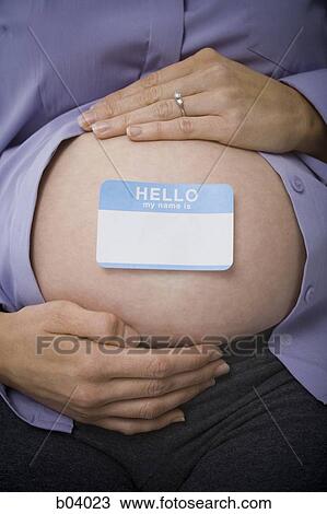 Closeup of pregnant belly with blank nametag View Large Photo Image Stock Image - Closeup of pregnant belly with blank nametag. Fotosearch