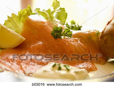 Stock Photograph - Closeup of smoked salmon appetizer. Fotosearch