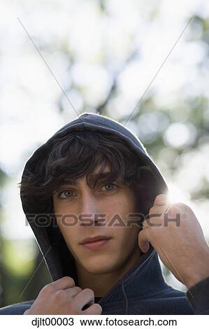 Closeup of teenage boy wearing hoodie View Large Photo Image Stock Image - Closeup of teenage boy wearing hoodie. Fotosearch