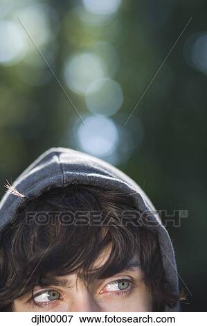 Stock Photo - Closeup of teenage boy wearing hoodie. Fotosearch