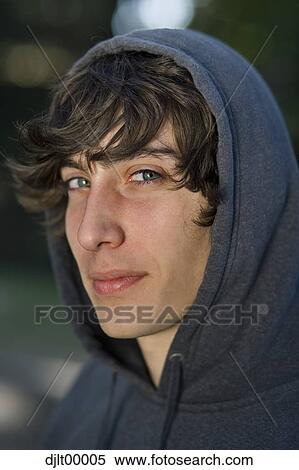 Stock Photography - Closeup of teenage boy wearing hoodie. Fotosearch