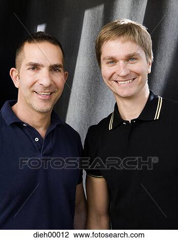 Stock Image - Closeup of two men. Fotosearch