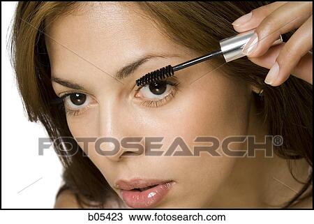 Closeup of woman applying mascara View Large Photo Image Stock Image - Closeup of woman applying mascara. Fotosearch