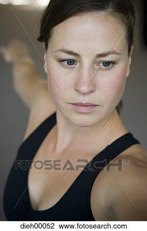 Closeup of woman doing yoga View Large Photo Image Stock Image - Closeup of woman doing yoga. Fotosearch
