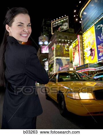Closeup of woman in city at night View Large Photo Image Stock Image - Closeup of woman in city at night. Fotosearch
