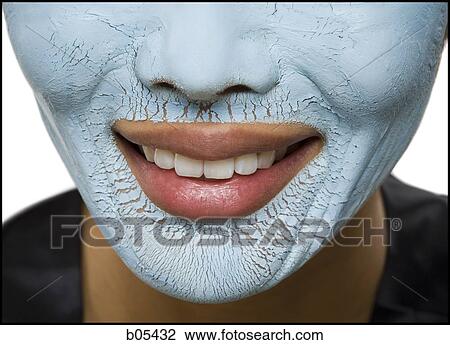 Closeup of woman smiling with facial mask View Large Photo Image Stock Image - Closeup of woman smiling with facial mask. Fotosearch