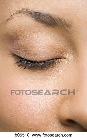 Stock Image - Closeup of woman with closed eyes. Fotosearch