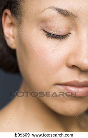 Closeup of woman with closed eyes View Large Photo Image Stock Photo - Closeup of woman with closed eyes. Fotosearch