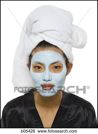 Closeup of woman with facial mask and hair towel View Large Photo Image Stock Photo - Closeup of woman with facial mask and hair towel. Fotosearch