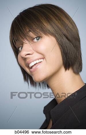 Closeup of woman with green eyes smiling View Large Photo Image Stock Photograph - Closeup of woman with green eyes smiling. Fotosearch