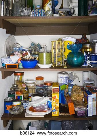 Picture - Cluttered shelving. Fotosearch