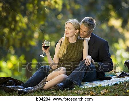 Couple drinking wine outdoors View Large Photo Image Picture - Couple drinking wine outdoors. Fotosearch