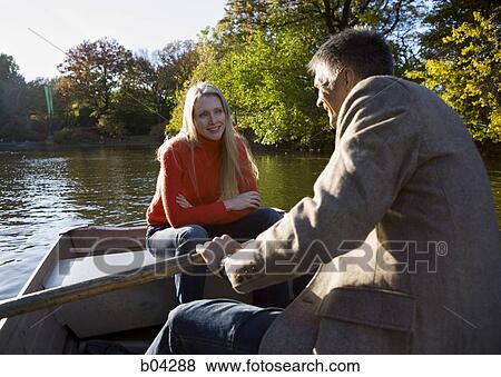 Couple in canoe View Large Photo Image Stock Photo - Couple in canoe. Fotosearch
