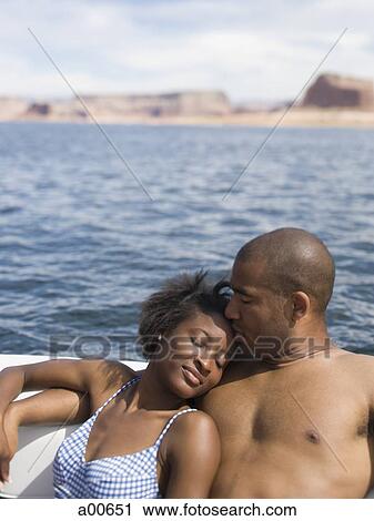 Couple on boat embracing View Large Photo Image Stock Image - Couple on boat embracing. Fotosearch