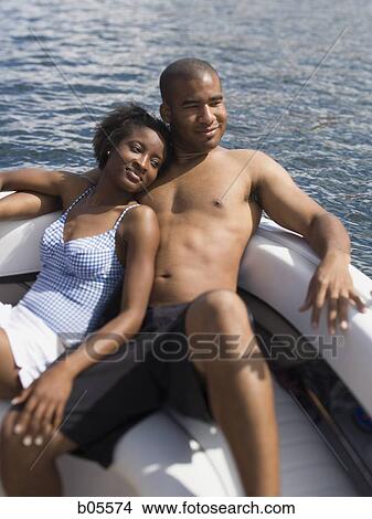 Couple on boat snuggling View Large Photo Image Picture - Couple on boat snuggling. Fotosearch