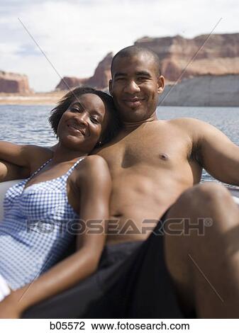 Couple on boat snuggling View Large Photo Image Stock Image - Couple on boat snuggling. Fotosearch