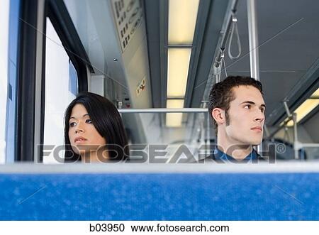 Couple sitting on bus or subway View Large Photo Image Stock Image - Couple sitting on bus or subway. Fotosearch