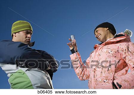 Couple using a camera outside View Large Photo Image Stock Photography - Couple using a camera outside. Fotosearch