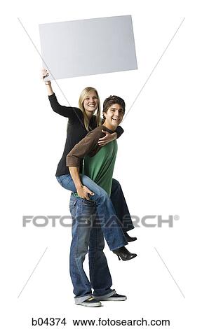 Couple with blank sign View Large Photo Image Picture - Couple with blank sign. Fotosearch
