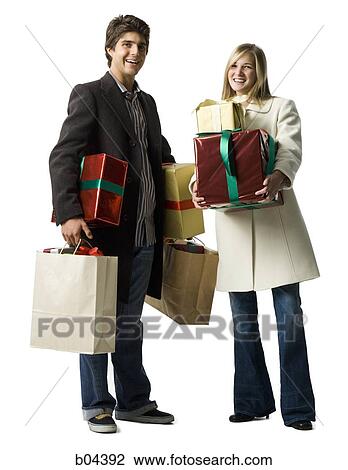 Stock Image - Couple with gift boxes. Fotosearch