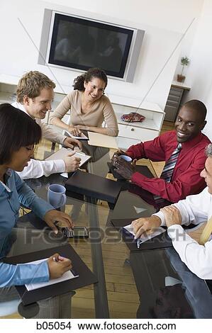 Picture - Discussion at business meeting with five people. Fotosearch