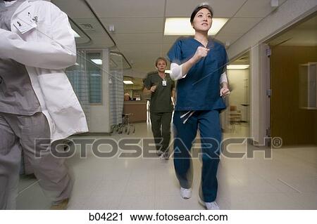Doctor and nurses rushing through corridor View Large Photo Image Stock Image - Doctor and nurses rushing through corridor. Fotosearch