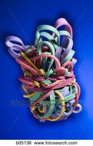 Stock Photo - Elastic bands knotted and intertwined. Fotosearch