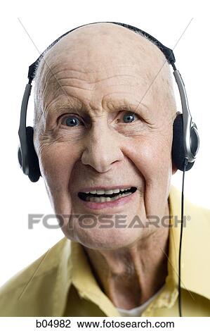 Elderly man with headphones View Large Photo Image Stock Image - Elderly man with headphones. Fotosearch