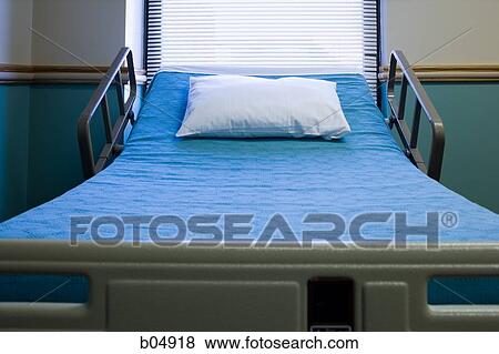 Stock Photo - Empty hospital bed with pillow. Fotosearch
