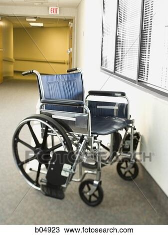 Empty wheelchair in corridor with windows View Large Photo Image Stock Image - Empty wheelchair in corridor with windows. Fotosearch
