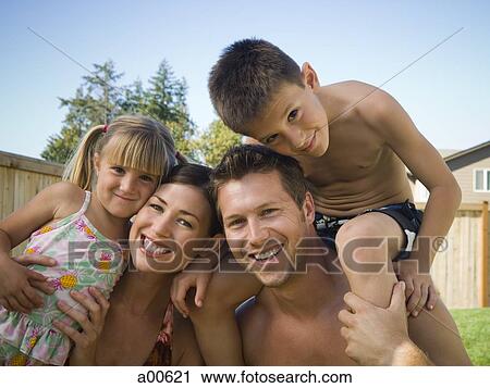 Family posing outdoors View Large Photo Image Stock Image - Family posing outdoors. Fotosearch