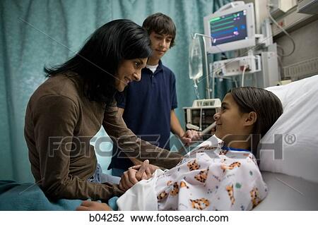 Family sitting with girl in hospital bed View Large Photo Image Stock Image - Family sitting with girl in hospital bed. Fotosearch
