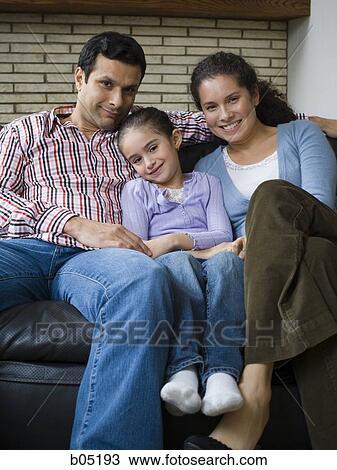 Family snuggling on sofa View Large Photo Image Stock Image - Family snuggling on sofa. Fotosearch