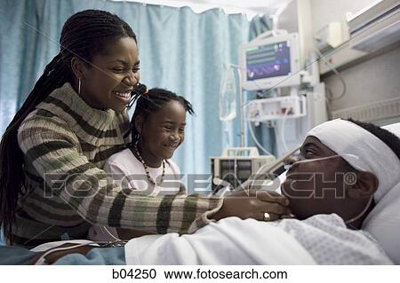 Family talking to boy in hospital bed View Large Photo Image Stock Image - Family talking to boy in hospital bed. Fotosearch