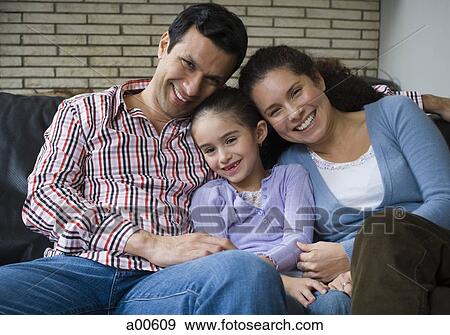 Female and male snuggling with girl smiling View Large Photo Image Stock Photo - Female and male snuggling with girl smiling. Fotosearch