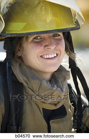 Female firefighter in helmet View Large Photo Image Stock Image - Female firefighter in helmet. Fotosearch