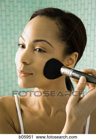Stock Image - Female grooming herself. Fotosearch