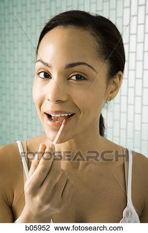 Female grooming herself View Large Photo Image Stock Image - Female grooming herself. Fotosearch