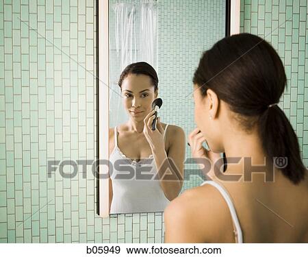 Female grooming herself View Large Photo Image Stock Photo - Female grooming herself. Fotosearch