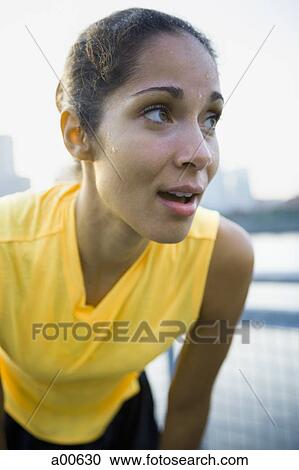 Female jogger sweating View Large Photo Image Stock Image - Female jogger sweating. Fotosearch