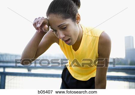 Female jogger sweating View Large Photo Image Stock Photo - Female jogger sweating. Fotosearch