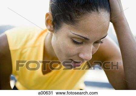 Female jogger taking a break View Large Photo Image Stock Image - Female jogger taking a break. Fotosearch