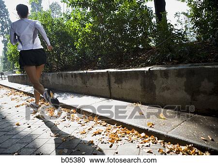 Female jogging rear view View Large Photo Image Stock Image - Female jogging rear view. Fotosearch