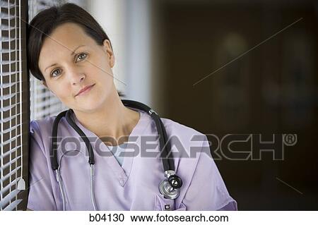 Female nurse leaning on blinds View Large Photo Image Stock Image - Female nurse leaning on blinds. Fotosearch