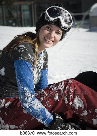 Female sitting outside in the snow View Large Photo Image Stock Image - Female sitting outside in the snow. Fotosearch